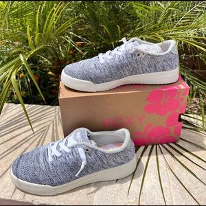 Woman’s grey and white knit sneakers